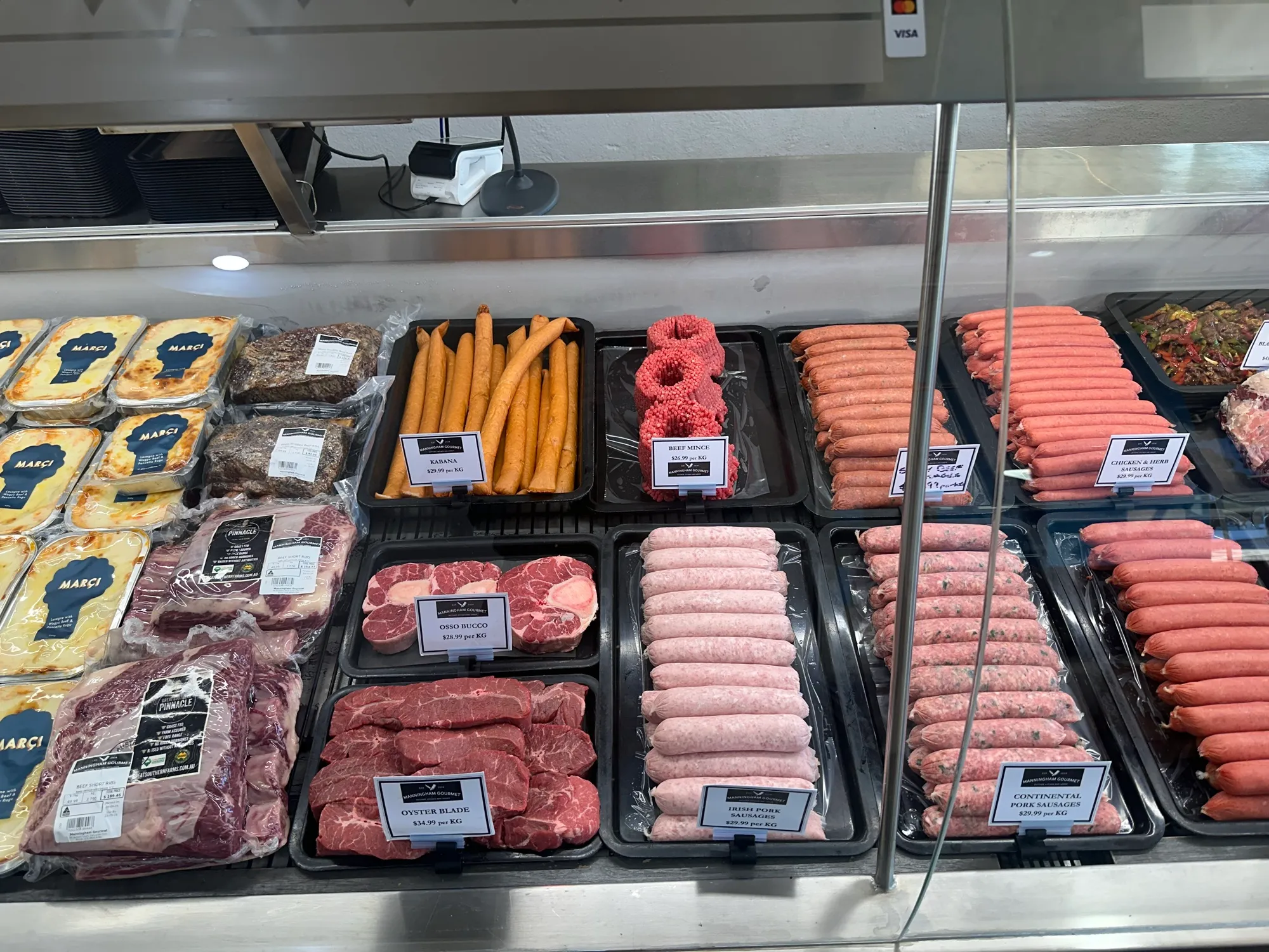 The long meat cabinet inside the shop
