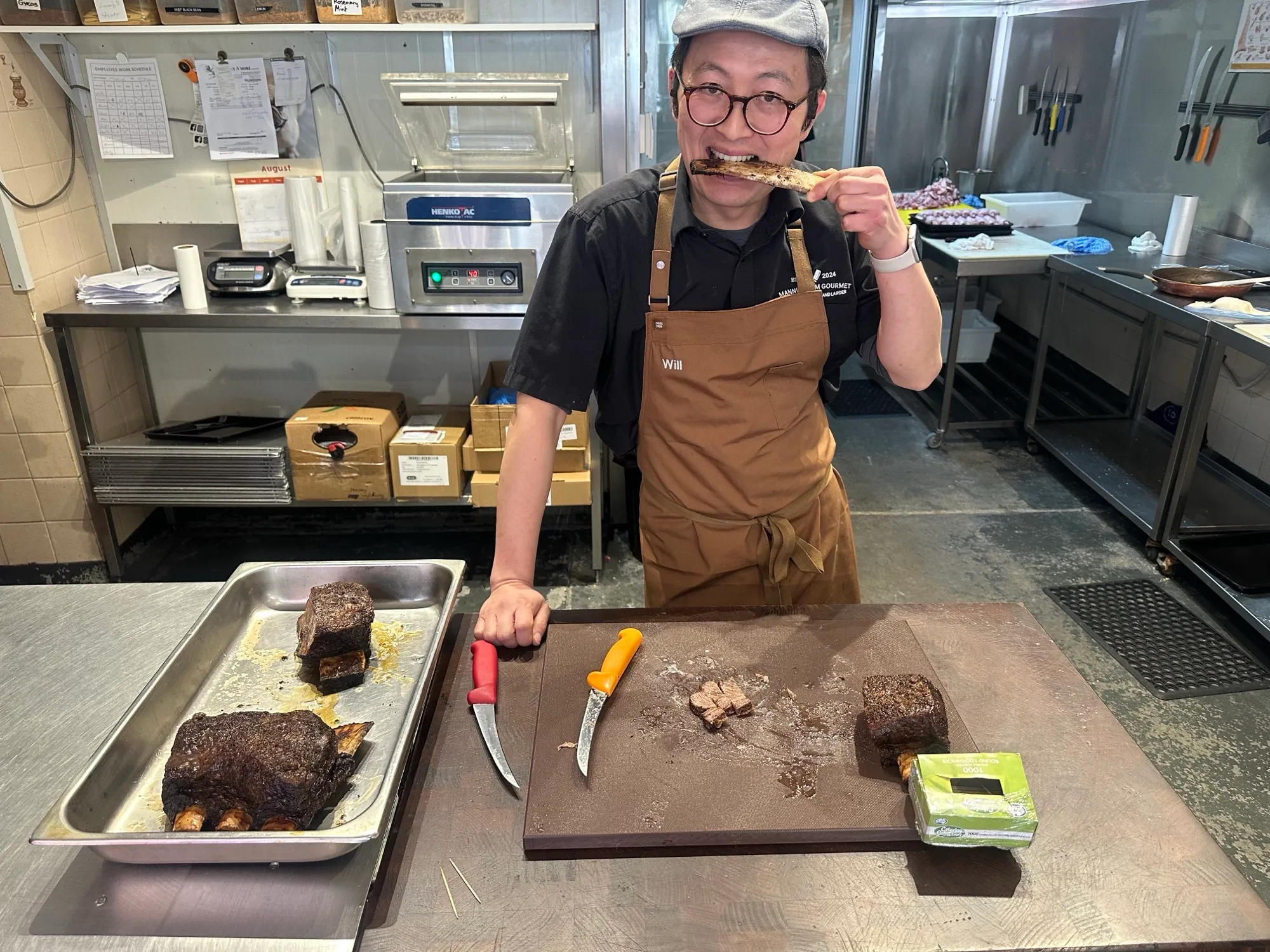 Will Yu in his apron at the butcher's block